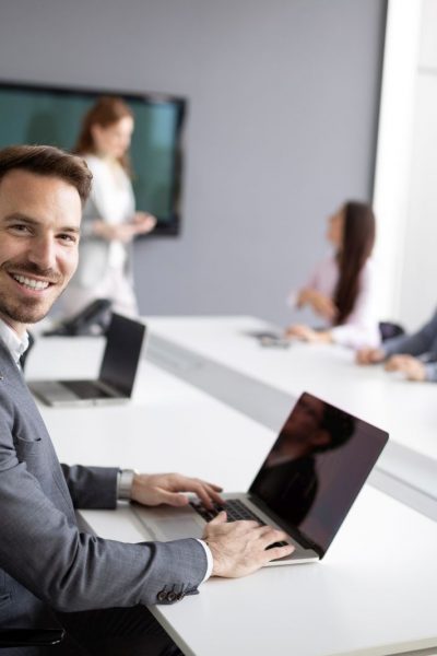 Business colleagues in modern conference meeting room during presentation